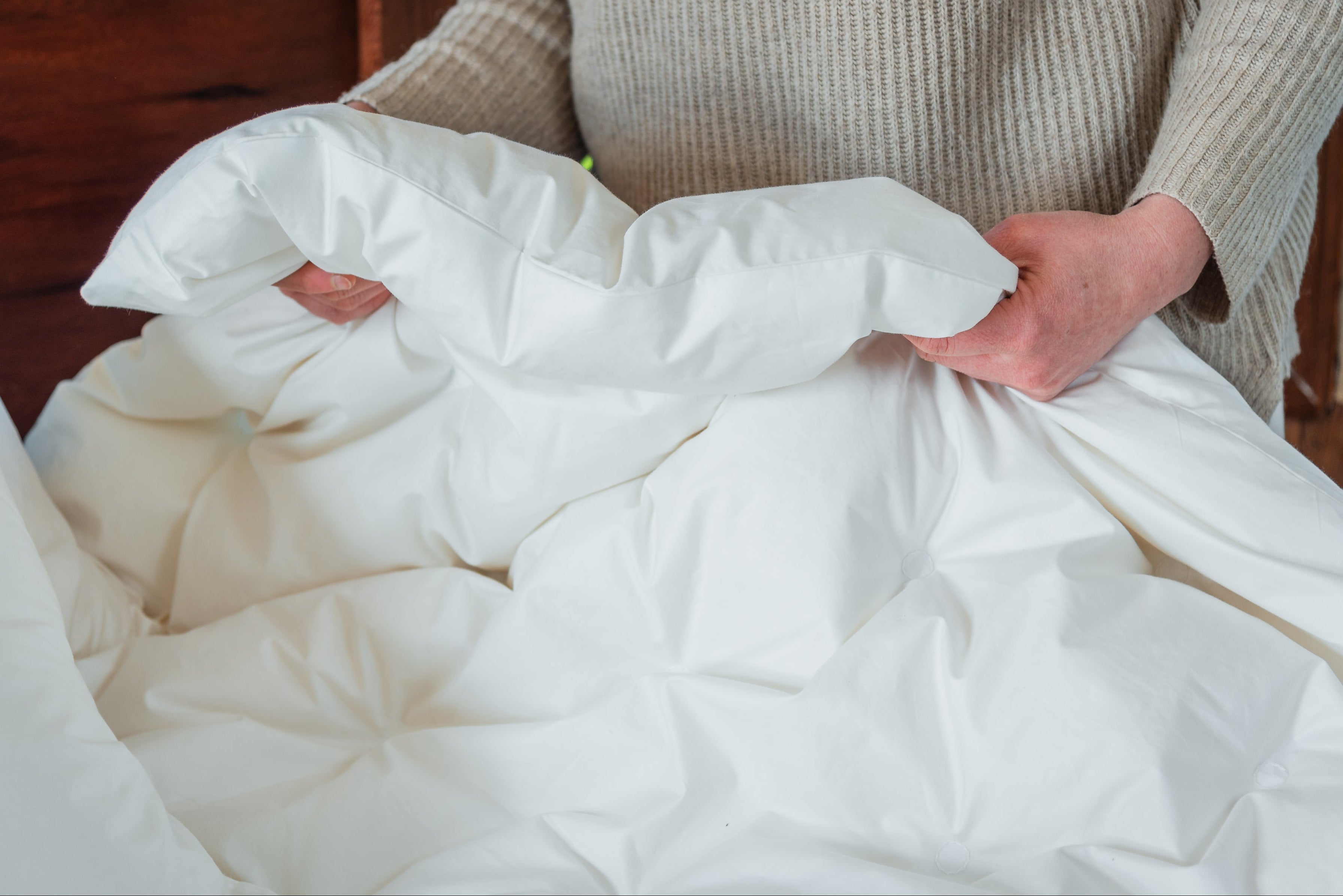 Servicio de mantención de plumones y almohadas de La Casa de los Gansos, con procesos de relleno, reducción, cambio de tela y restauración artesanal para conservar suavidad y confort.