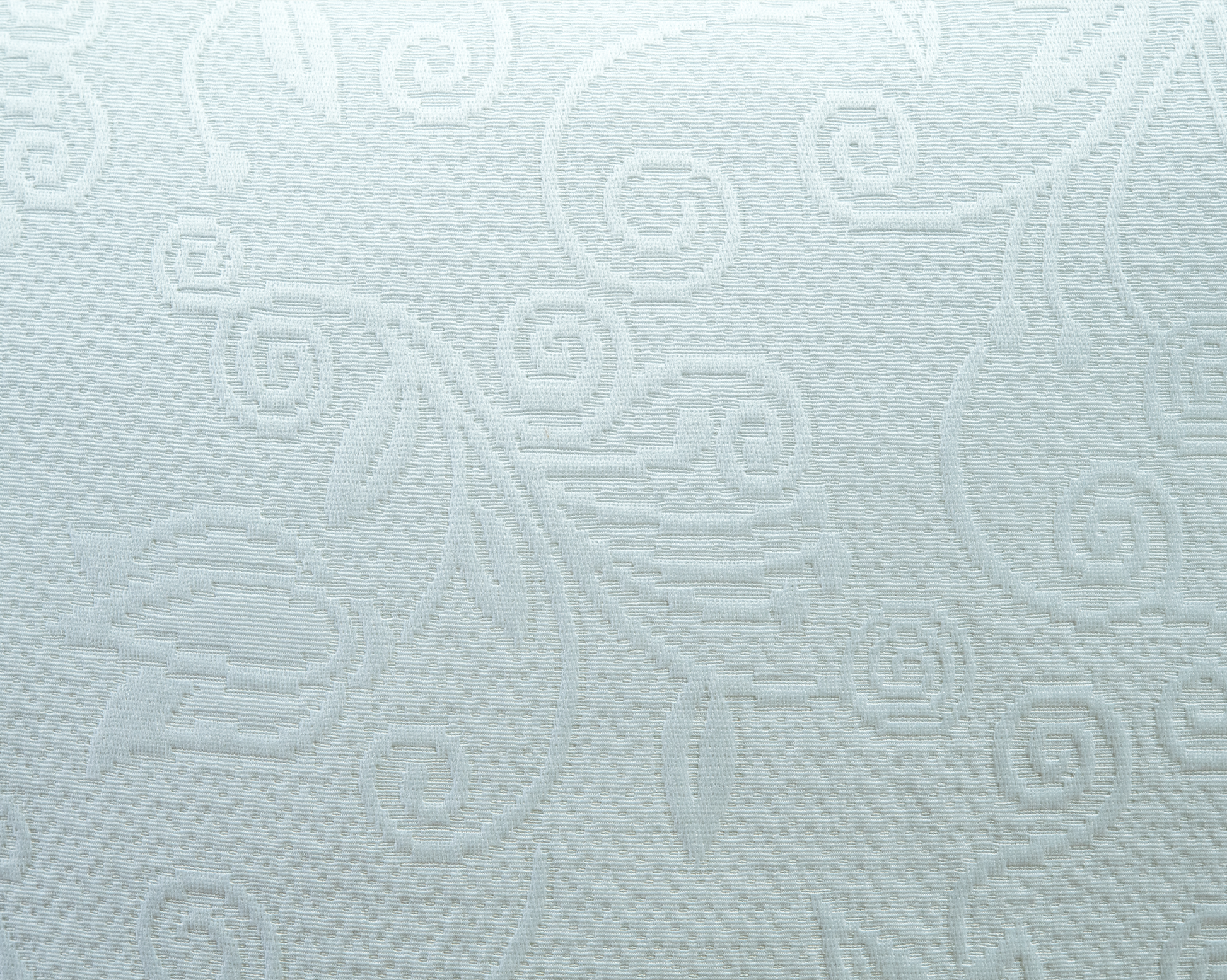 Textura suave y natural del cojín lector Piqué Blanco de La Casa de los Gansos, vista en primer plano